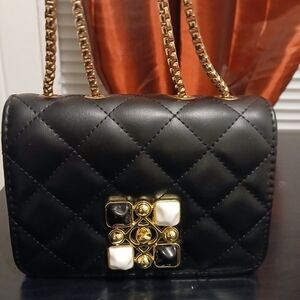 Elegant Black Quilted Handbag with Gold Accents